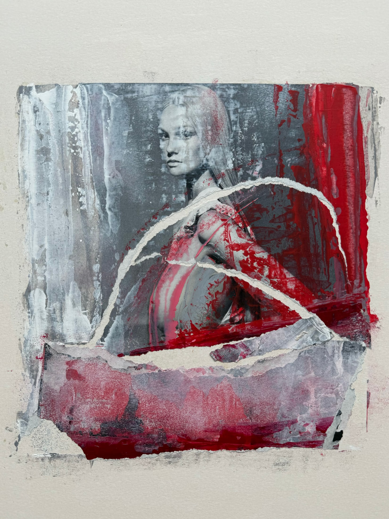 Layered female portrait with red and gray painted marks and torn paper