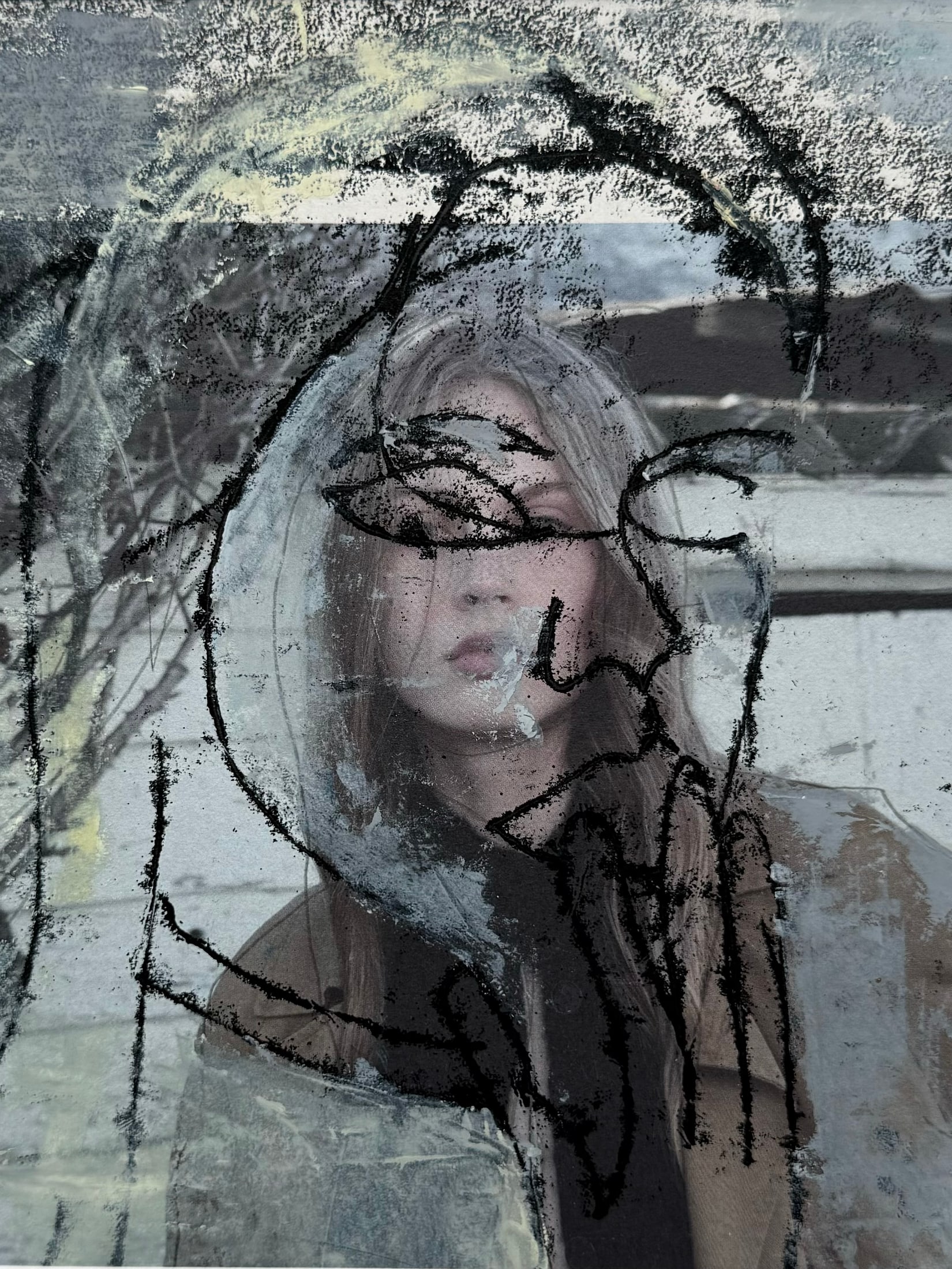 Monochrome portrait with bold black gestural lines across the face